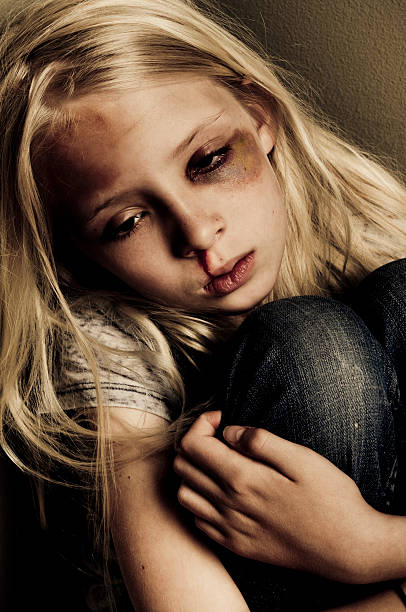 abused little girl stock photo