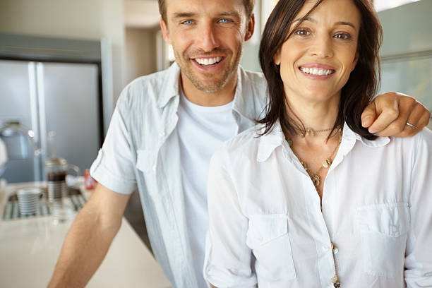 istock Couple in the kitchen smiling in the morning 117148473