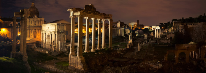 Panoramic view taken by joining a sequence of several photos. The white marble Arch of Septimius Severus at the northeast end of the Roman Forum is a triumphal arch dedicated in AD 203 to commemorate the Parthian victories of Emperor Septimius Severus and his two sons, Caracalla and Geta, in the two campaigns against the Parthians of 194/195 and 197-199.