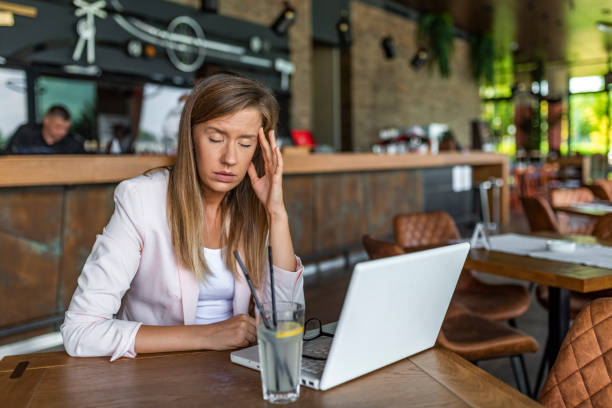 istock Overworking business woman suffering from headache 1171487133