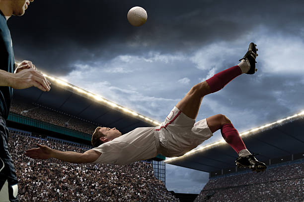 istock football player doing overhead kick 117148733