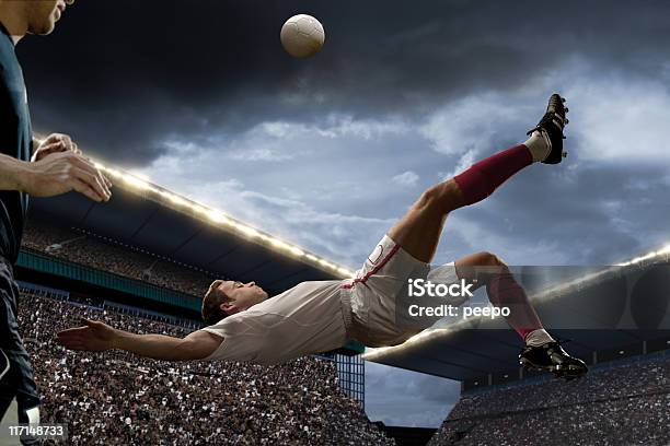 Football Player Doing Overhead Kick Stock Photo - Download Image Now - Bicycle Kick, Jumping, Soccer