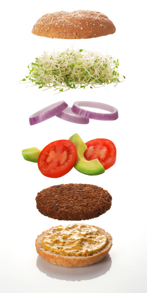 Exploded view of a typical veggie burger, with sprouts, tomatoes, avocados, onions, grain mustard, hand made veggie patty, and a whole-grain Kaiser bun.\n[url=file_closeup.php?id=8259777][img]file_thumbview_approve.php?size=1&id=8259777[/img][/url]