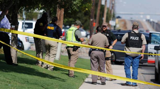 Texas shooting leaves at least 21 injured and 5 dead A law enforcement officer stands in the middle of the 5100 block of E. 42nd Street in Odessa, Texas, Saturday, Aug. 31, 2019, following a shooting at random in the area of Odessa and Midland. Several people were dead after a gunman who hijacked a postal service vehicle in West Texas shot more than 20 people. gunman photos stock pictures, royalty-free photos & images