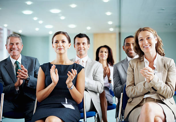istock Successful business people clapping in a conference room 117149000