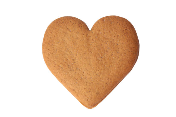 Gingerbread heart Gingerbread heart isolated on white background gingerbread biscuit stock pictures, royalty-free photos & images