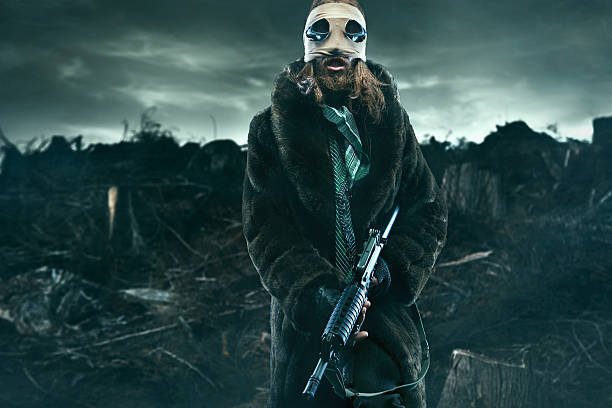 A grisly long haired, bearded man holding an automatic machine gun stands in a future barren smoke filled futuristic wasteland, the result of natural causes, or nuclear holocaust...\nHorizontal with copy space.\n\n[url=http://www.istockphoto.com/file_search.php?action=file&lightboxID=11961997#1bd3ad1c][IMG]http://i186.photobucket.com/albums/x196/hybridsoul2/GasMaskban.jpg[/IMG][/url]\n\n[url=file_closeup?id=50541514][img]/file_thumbview/50541514/1[/img][/url] [url=file_closeup?id=19304583][img]/file_thumbview/19304583/1[/img][/url] [url=file_closeup?id=5386472][img]/file_thumbview/5386472/1[/img][/url] [url=file_closeup?id=16122002][img]/file_thumbview/16122002/1[/img][/url] [url=file_closeup?id=13319657][img]/file_thumbview/13319657/1[/img][/url] [url=file_closeup?id=15452193][img]/file_thumbview/15452193/1[/img][/url] [url=file_closeup?id=15978590][img]/file_thumbview/15978590/1[/img][/url]