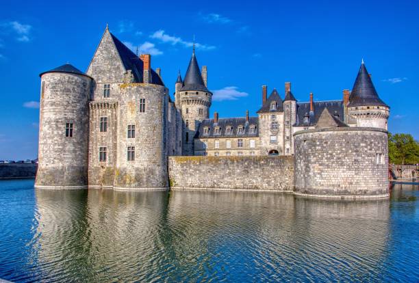 Famous medieval castle Sully sur Loire. Sully Sur Loire, France - April 13, 2019: Famous medieval castle Sully sur Loire, Loire valley, France. The chateau Sully sur Loire dates from the end of the 14th century and is a prime example of medieval fortress. loire atlantique photos stock pictures, royalty-free photos & images