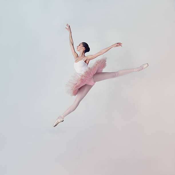Jumping ballet dancer stock photo