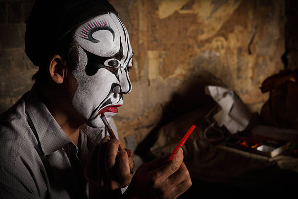 one Chinese opera actor in make-up one Chinese opera actor in make-up,He is a folk artist. chinese opera makeup stock pictures, royalty-free photos & images