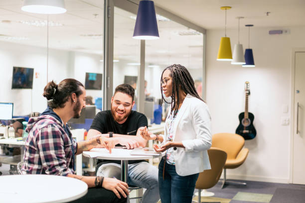 istock Young business people discussing in creative office 1171494464