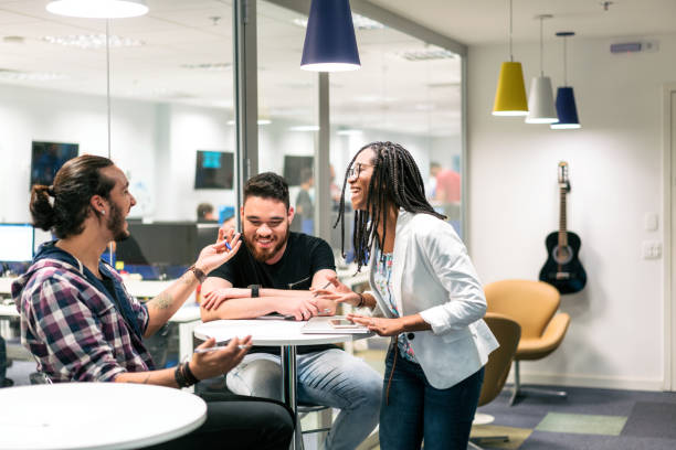 istock Young business people discussing in creative office 1171494500
