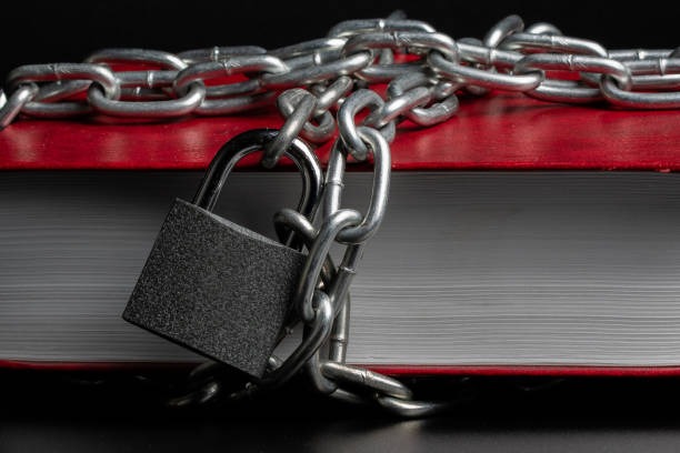 istock book red on a black background wrapped around the book chain on the chain 1171494931
