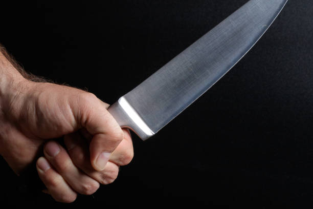 istock a large kitchen knife in the hand of man 1171494983