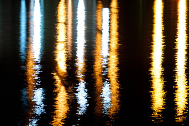 istock strips of light in the reflection on the water 1171495180