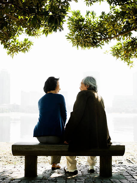 istock Senior Asian Couple on a Park Bench 117149577