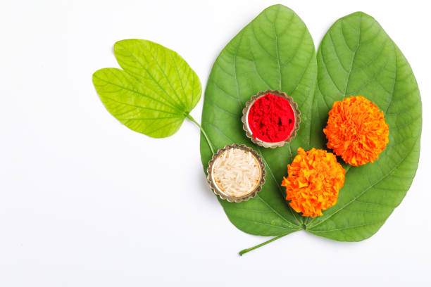 istock Happy Dussehra greeting card , green leaf and rice 1171496333