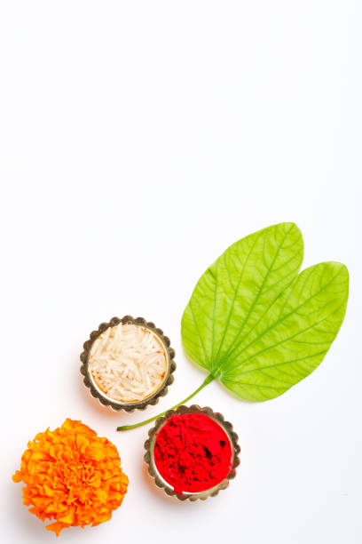 istock Happy Dussehra greeting card , green leaf and rice 1171496456