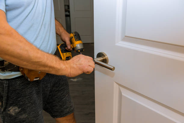 istock Hands repairing a door lock 1171496488