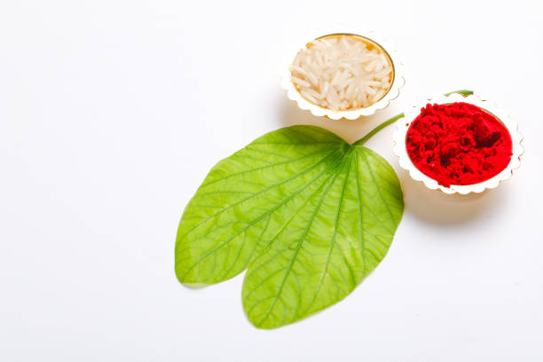 istock Happy Dussehra greeting card , green leaf and rice 1171496726