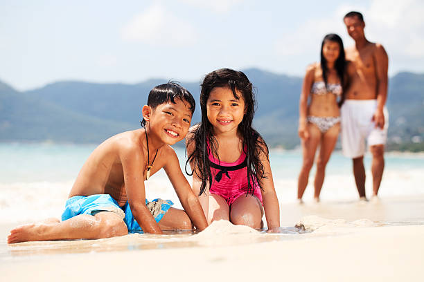 istock Beautiful Asian family on the beach. 117149709