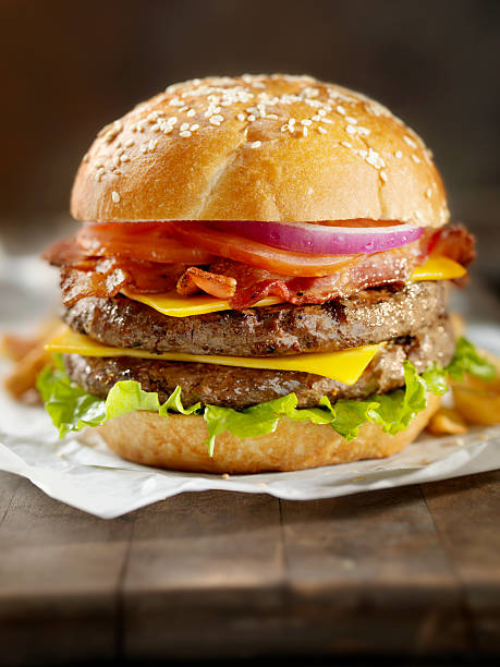 ダブルベーコンチーズバーガー - symmetry burger hamburger cheese ストックフォトと画像