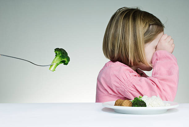 istock Trying To Get a Child To Eat Her Greens 117149800