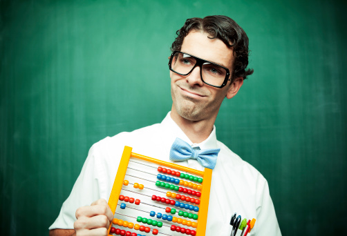 A male nerd poses with an abacus.