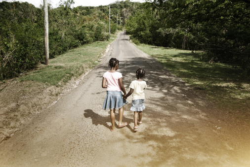 the road ahead for two sisters; walking hand in hand