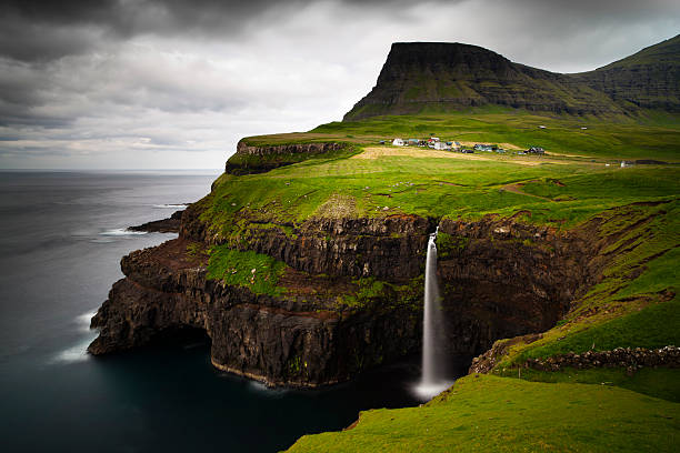 The breath taking view of Gasadalur with a waterfalls stock photo