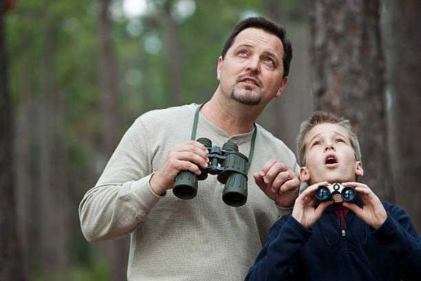 istock Father and son enjoying scenic view with binoculars 117150326