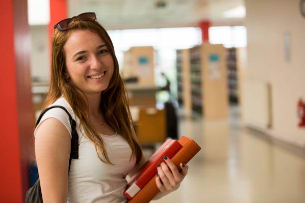 istock Female student in the library 1171505386