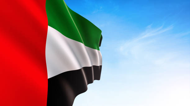 United Arab Emirates flag waving in blue sky, UAE Flag UEA Flag, National Flag, Isolated, blue sky with clouds, Wind national holiday stock pictures, royalty-free photos & images
