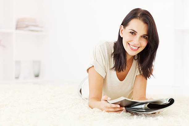 Woman Reading a Magazine on the Floor