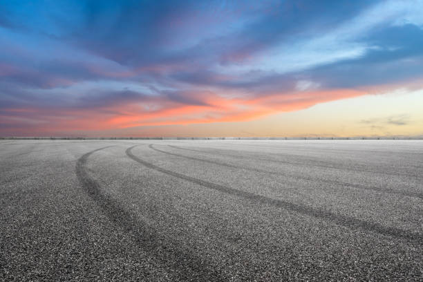 istock Race track road and beautiful sky clouds at sunset 1171509043