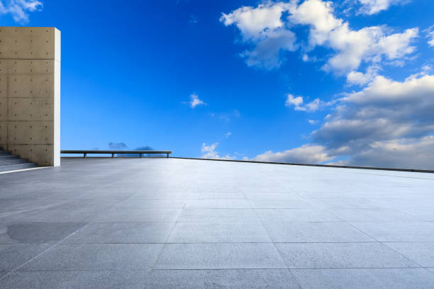 istock Wide square floor and blue sky with white clouds 1171509057