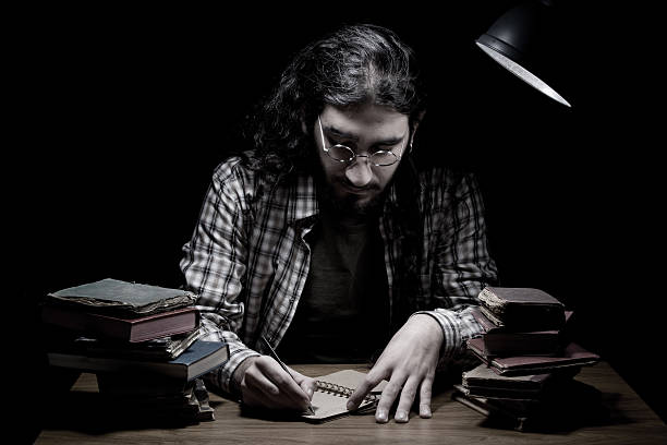 istock Novelist writing on table in the dark 117150942
