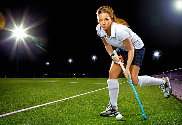 female hockey player running female hockey player running  field hockey stock pictures, royalty-free photos & images