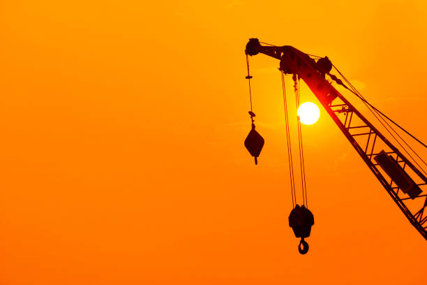 istock Silhouette Crane in building construction site on Sunset Background. 1171511377