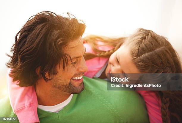 Happy Father Piggybacking His Smiling Cute Daugther On The Beach Stock Photo - Download Image Now