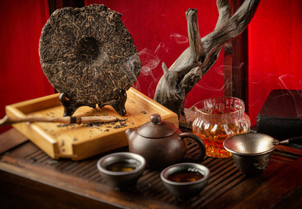 istock tea table with instruments teapots cups pancake and tea Shen Puer 1171512239