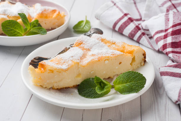 istock Cottage cheese casserole on a plate with powdered sugar and mint leaves. Selective focus 1171513171