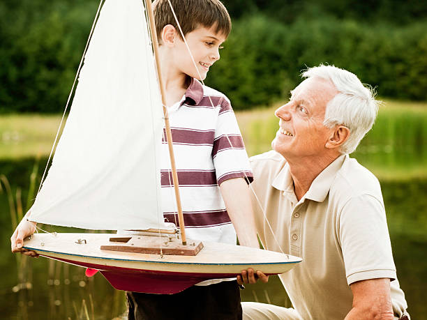 Grandfather and Grandson at the Park http://i152.photobucket.com/albums/s173/ranplett/children.jpg toy boat stock pictures, royalty-free photos & images