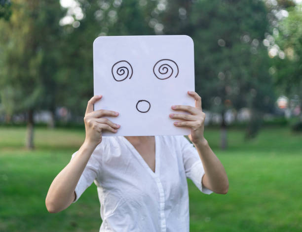 Girl Holding a Whiteboard Facial Expression : Confusion