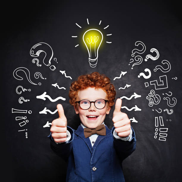istock Happy smart child boy in blue suit and  lightbulb 1171514891
