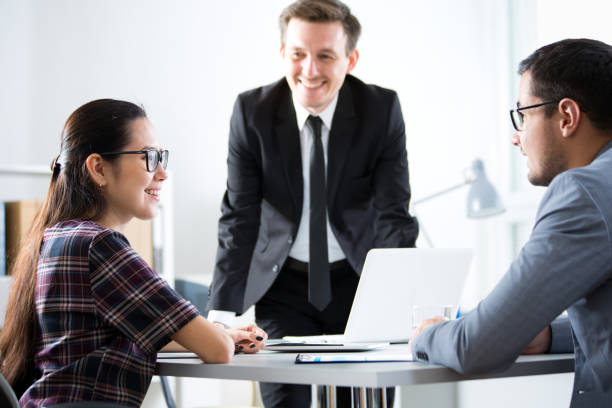 istock Businessmen recruit a young employee 1171515066