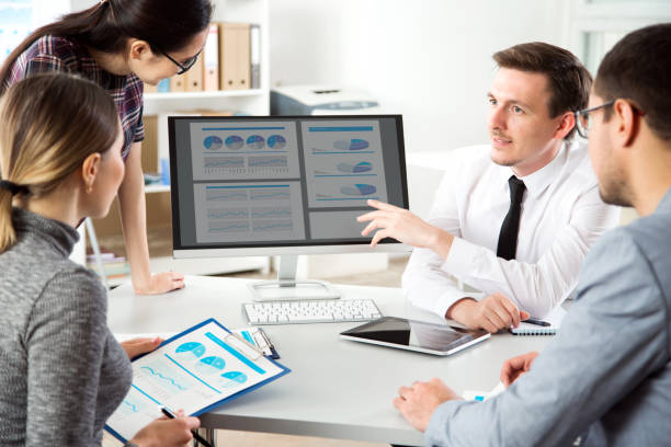 istock Businessman explains to colleagues a new project 1171515790