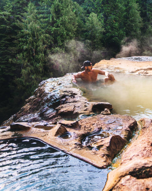 istock man resting in an hot spring in oregon 1171515883