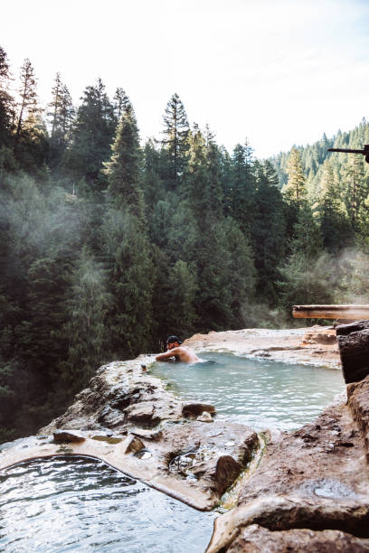 istock man resting in an hot spring in oregon 1171515940