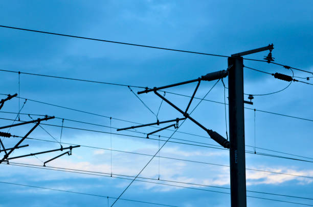 istock Railway power lines on a blue sky background 1171517405